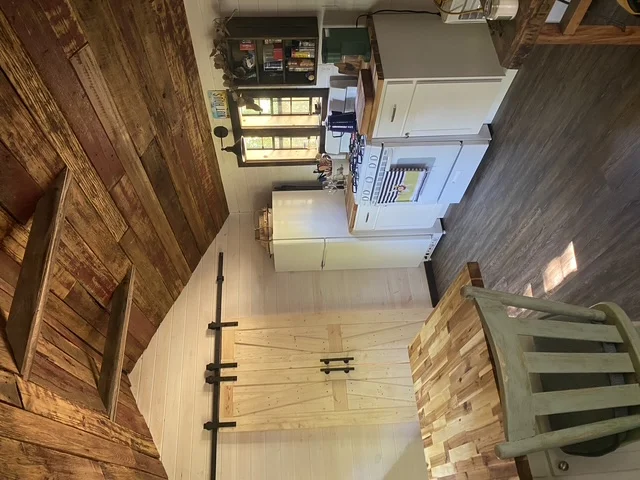 Kitchen remodel with light wood cabinets, stainless steel appliances, and updated flooring